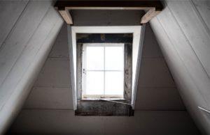 Home attic with window that could allow moisture into the home